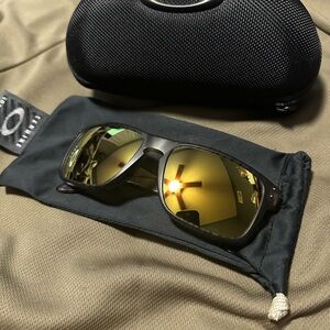 Oakley Sunglasses with Black Frame and Gold Lenses